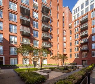 A view of a building courtyard surrounded by architecture