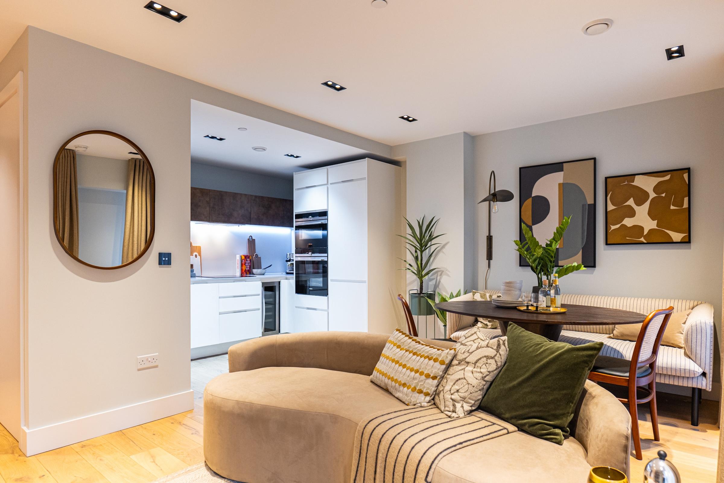 Living room with a partial view of the kitchen